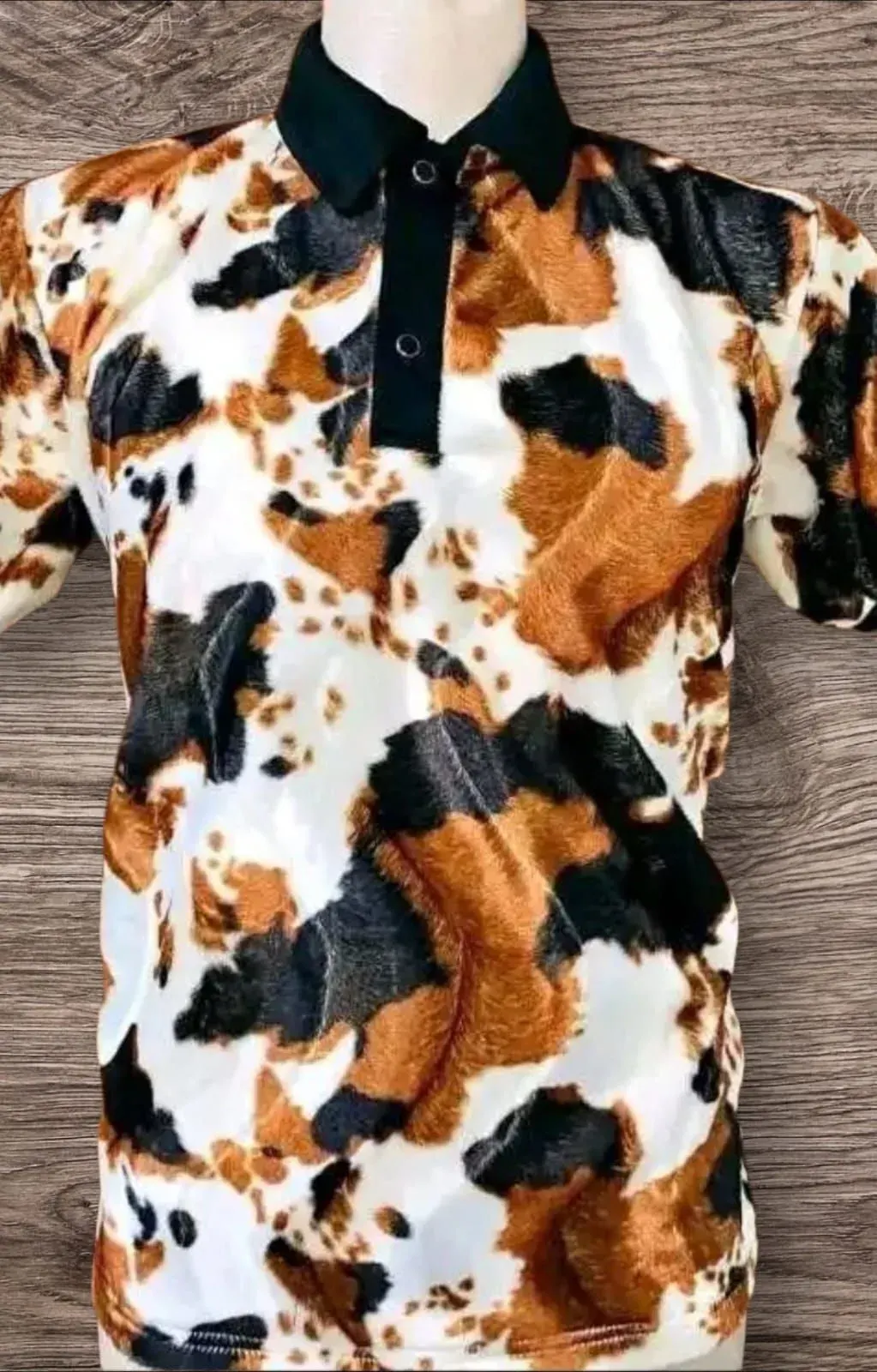 Bhinca cow-print golf shirt with black collar by Nosibele Design & Embroidery, Durban