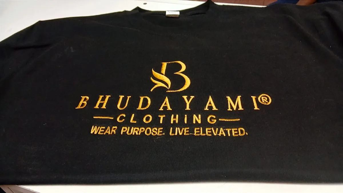Black t-shirt with gold Bhudayami Clothing logo embroidery