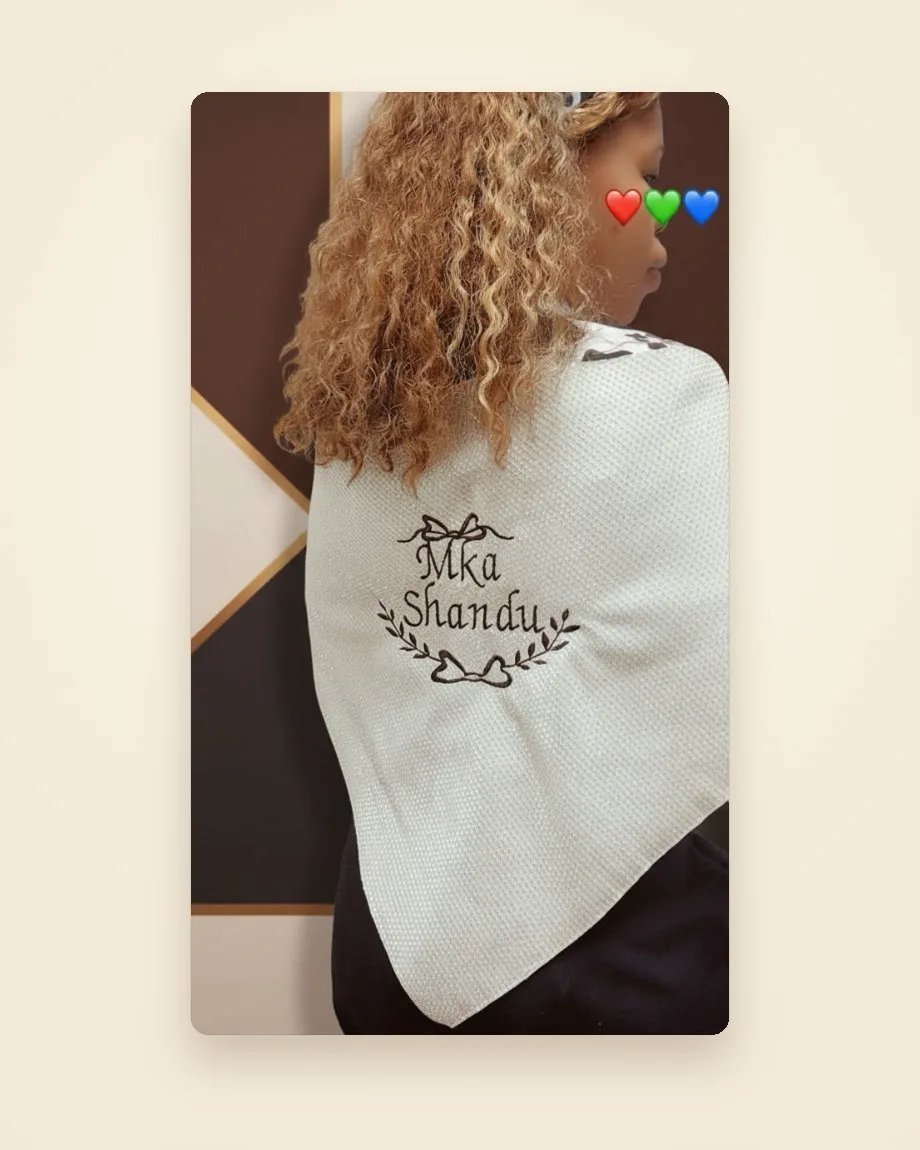 Soft scarves embroidered with personalised names and decorative motifs